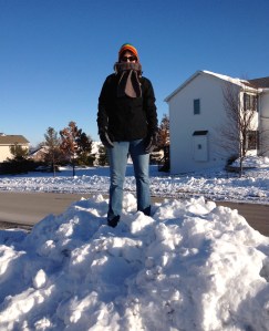 Tammy stands atop a huge pile of snow in our neighborhood after a December 2012 blizzard.